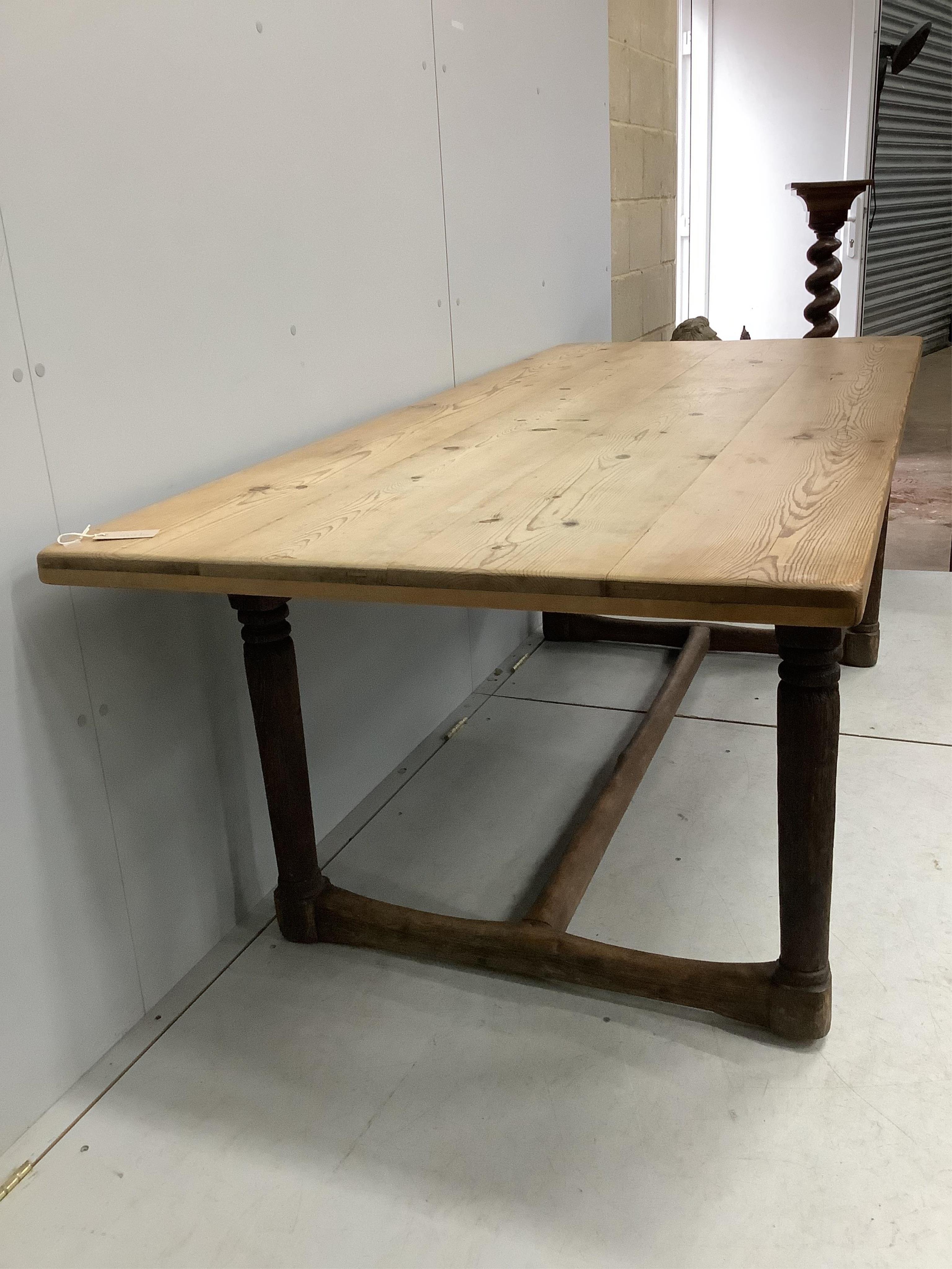 An 18th century oak refectory dining table with later pine top, width 206cm, depth 91cm, height 72cm. Condition - poor to fair